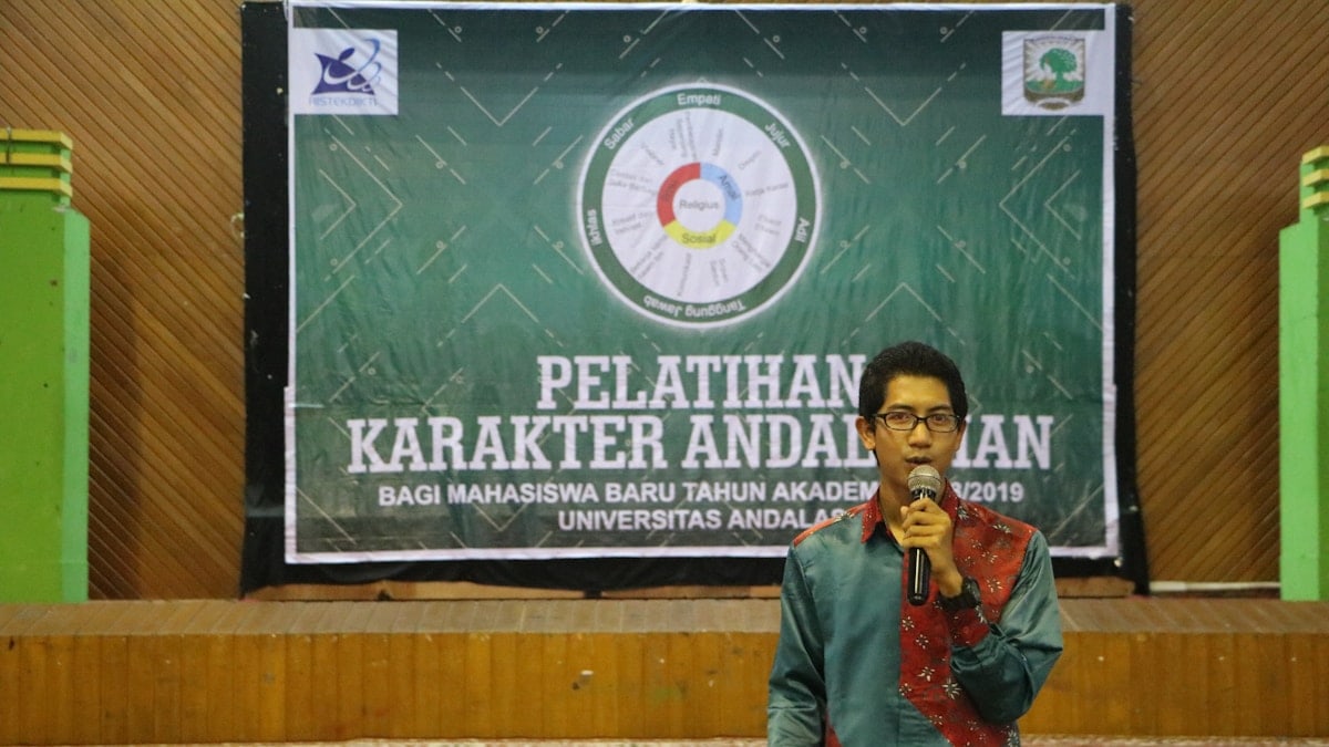 a man standing in front of a microphone